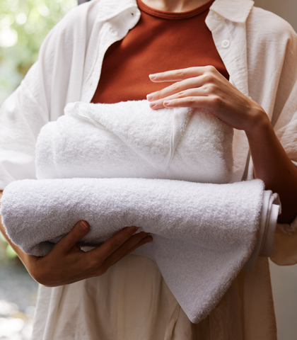 women carrying towels